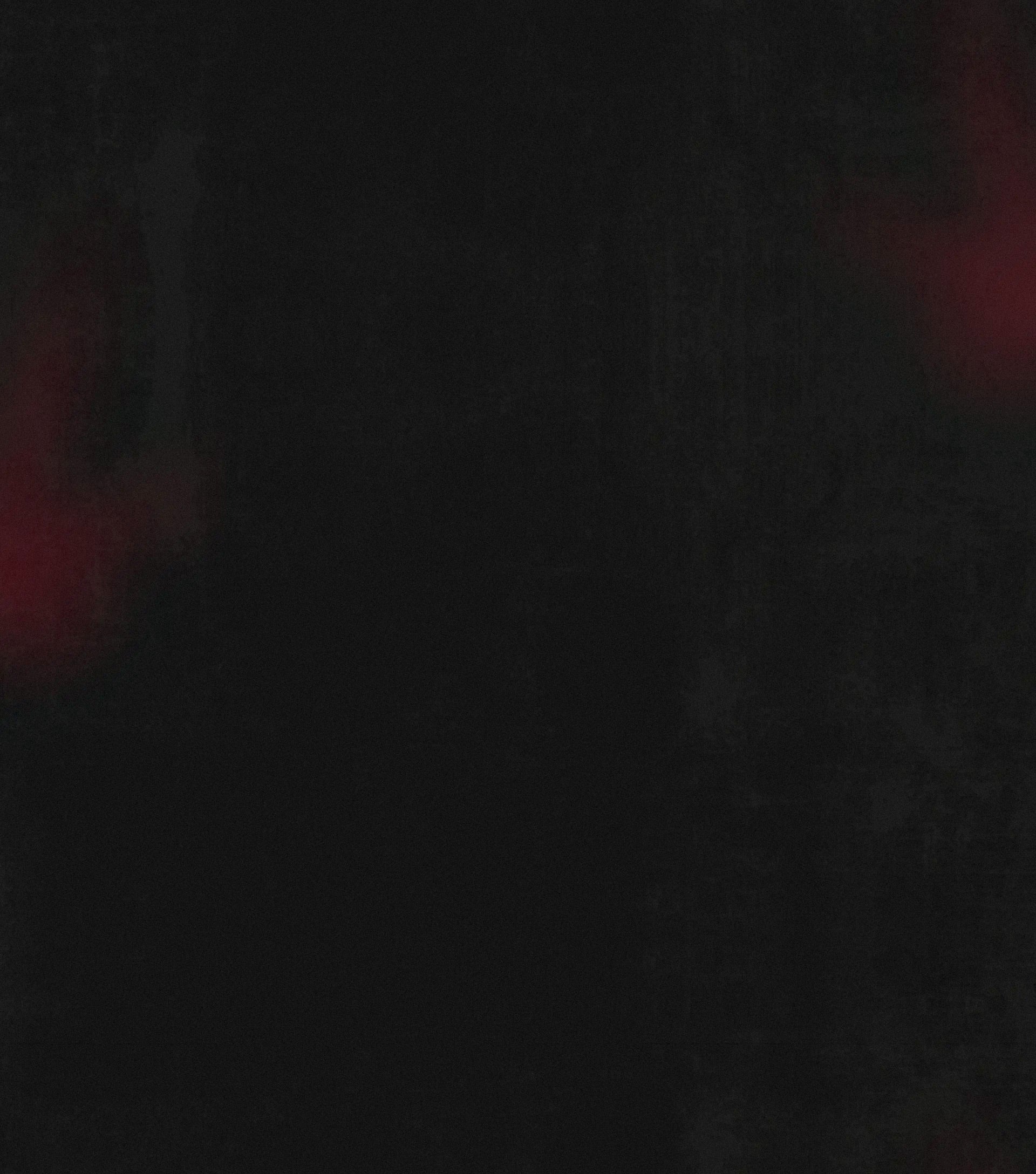 Black grunge texture with red glowing on the sides